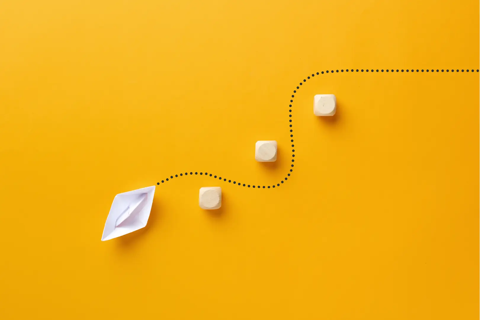 A boat made of paper sailing on a line around touch-points. All on an orange background.