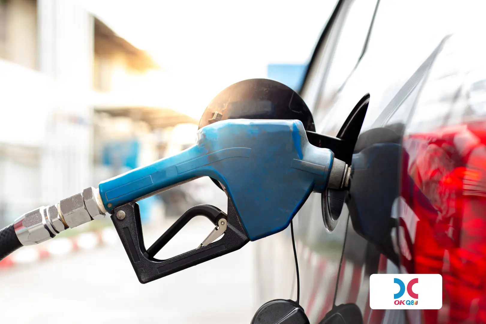 A car getting fuel on a OKQ8 gas station.