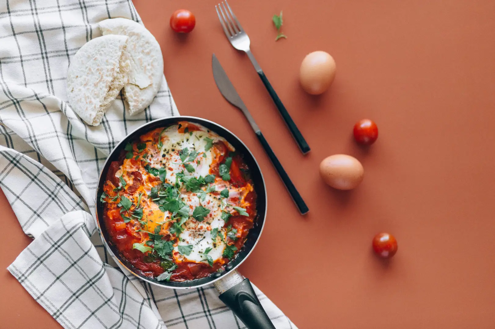 Different type of food on a table showcasing that the page includes guidance and a template for your delivery and food order customer journey.